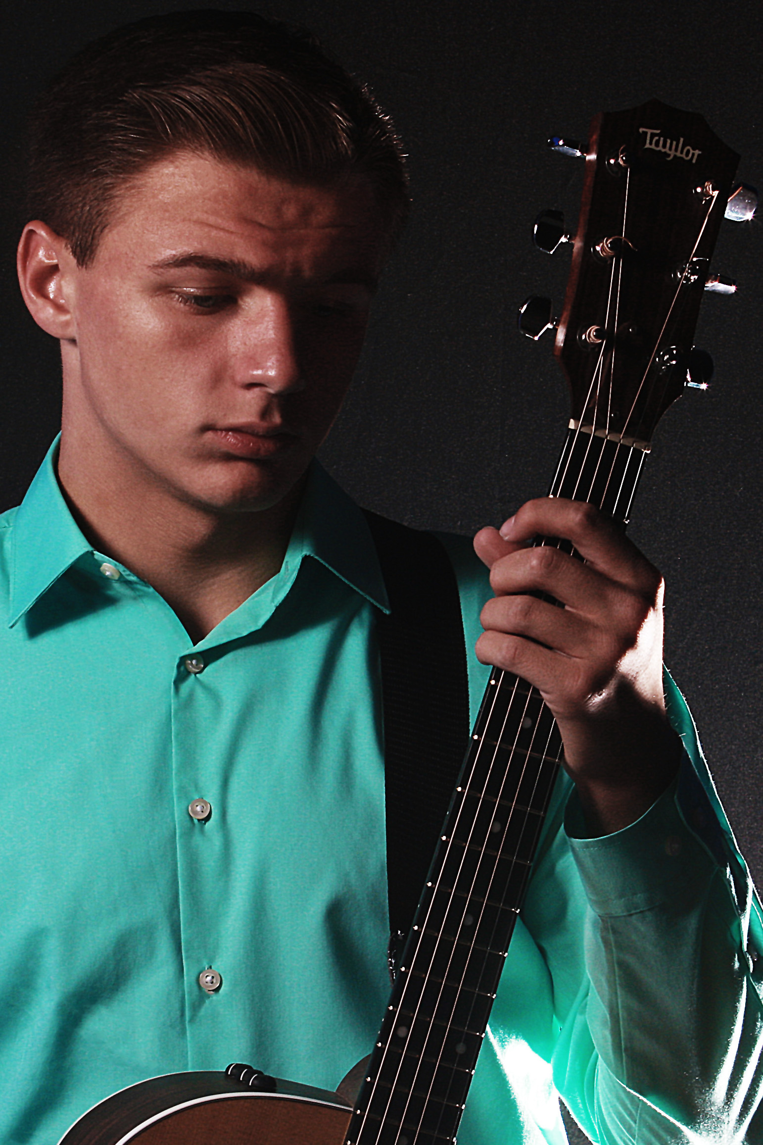 Bailey Williams posing with his guitar