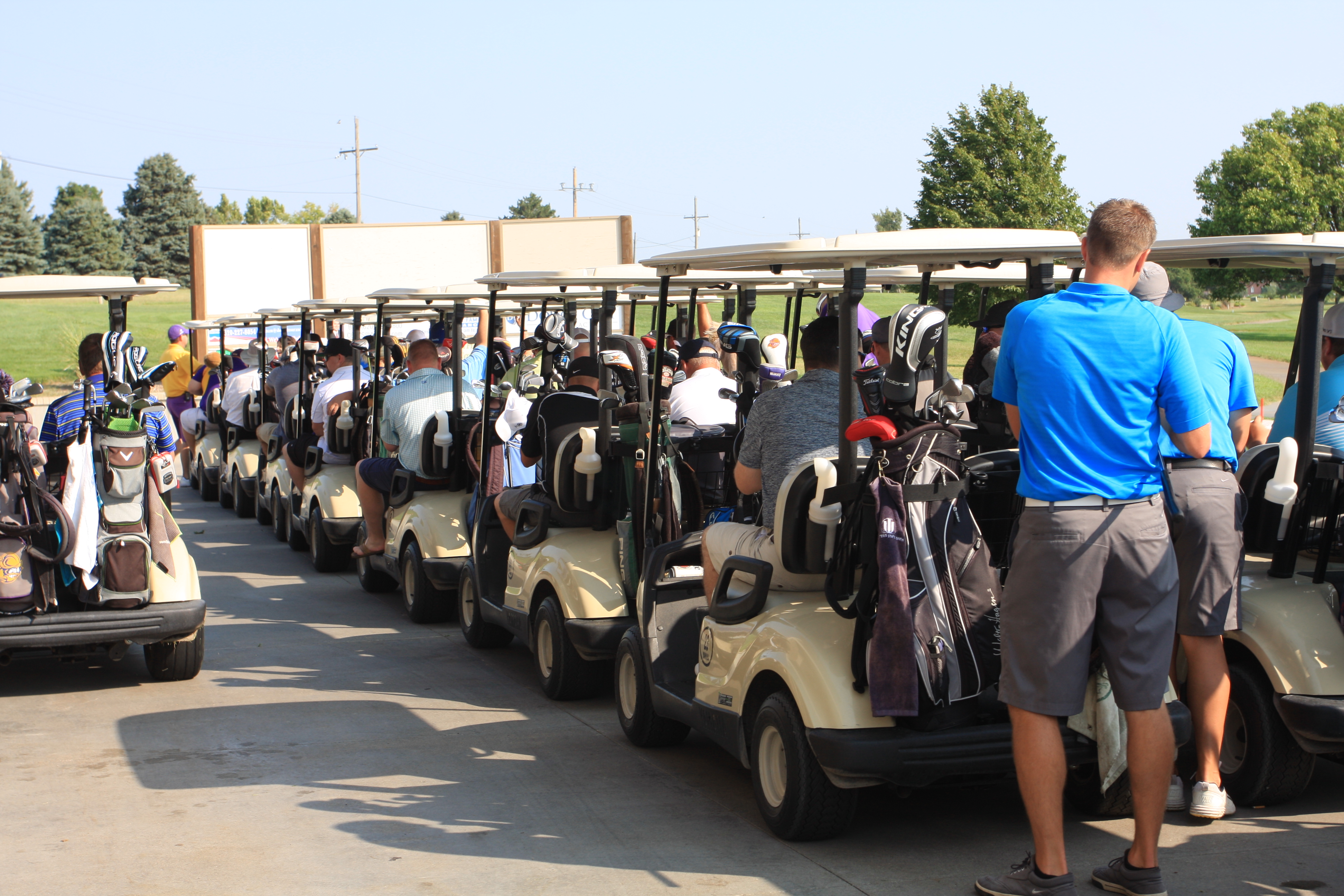 Golfers load their carts in preparation for the shotgun start to the 2018 DC3 Foundation Golf Classic