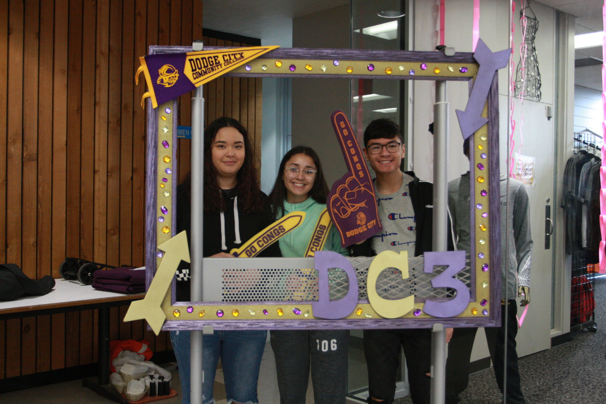 Juniors posing in a decorative frame during the 2020 Junior Experience