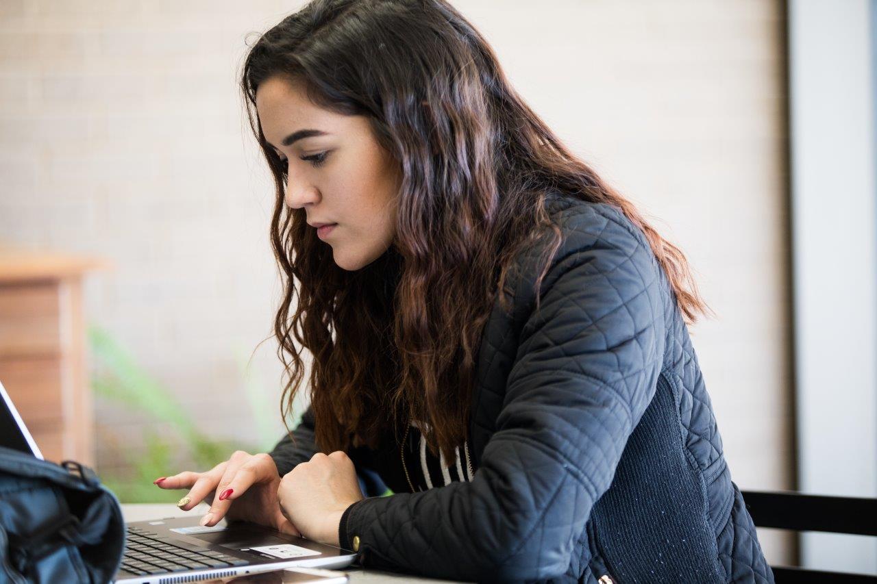 Student works on laptop