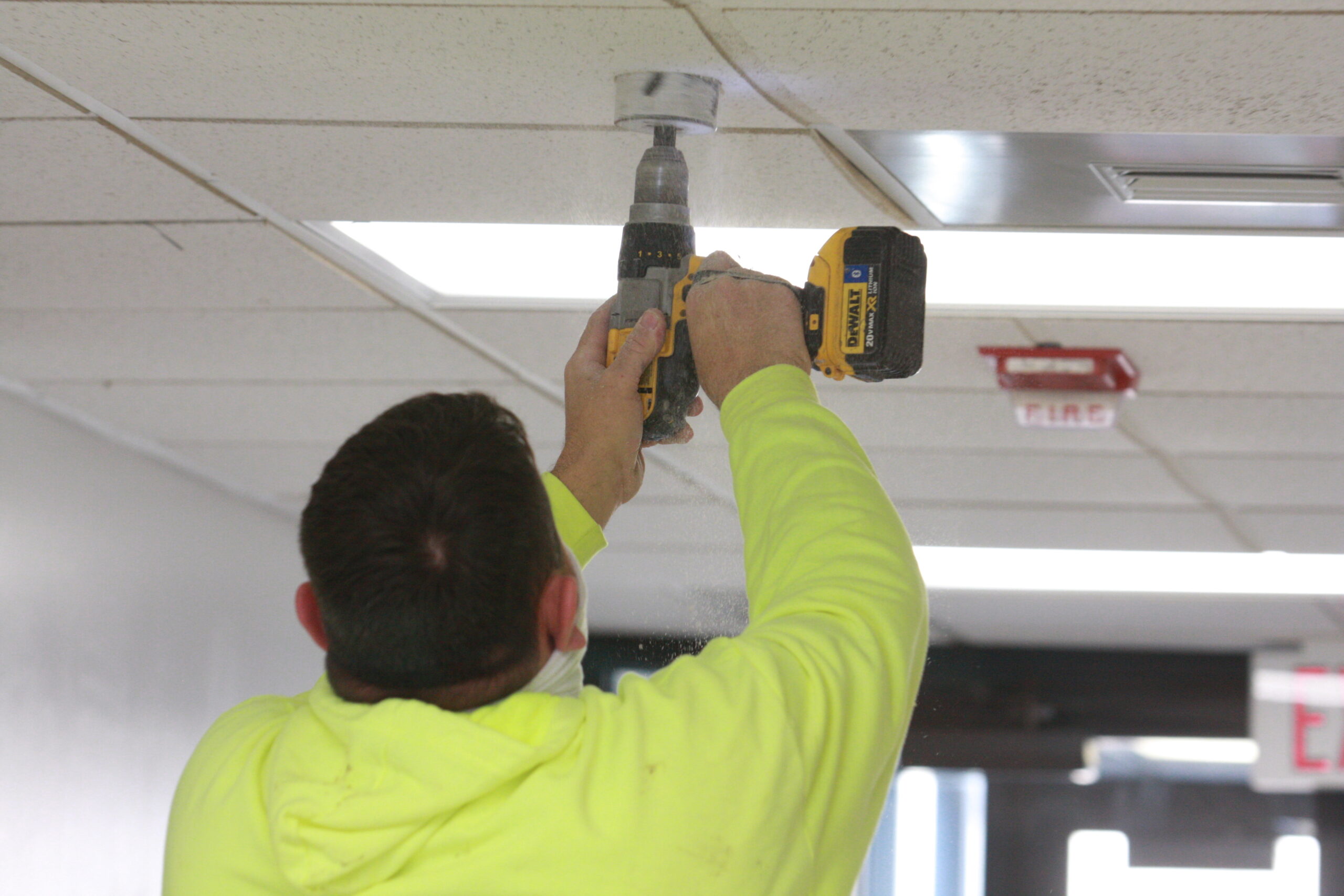 Convergint Technologies representative installing cameras