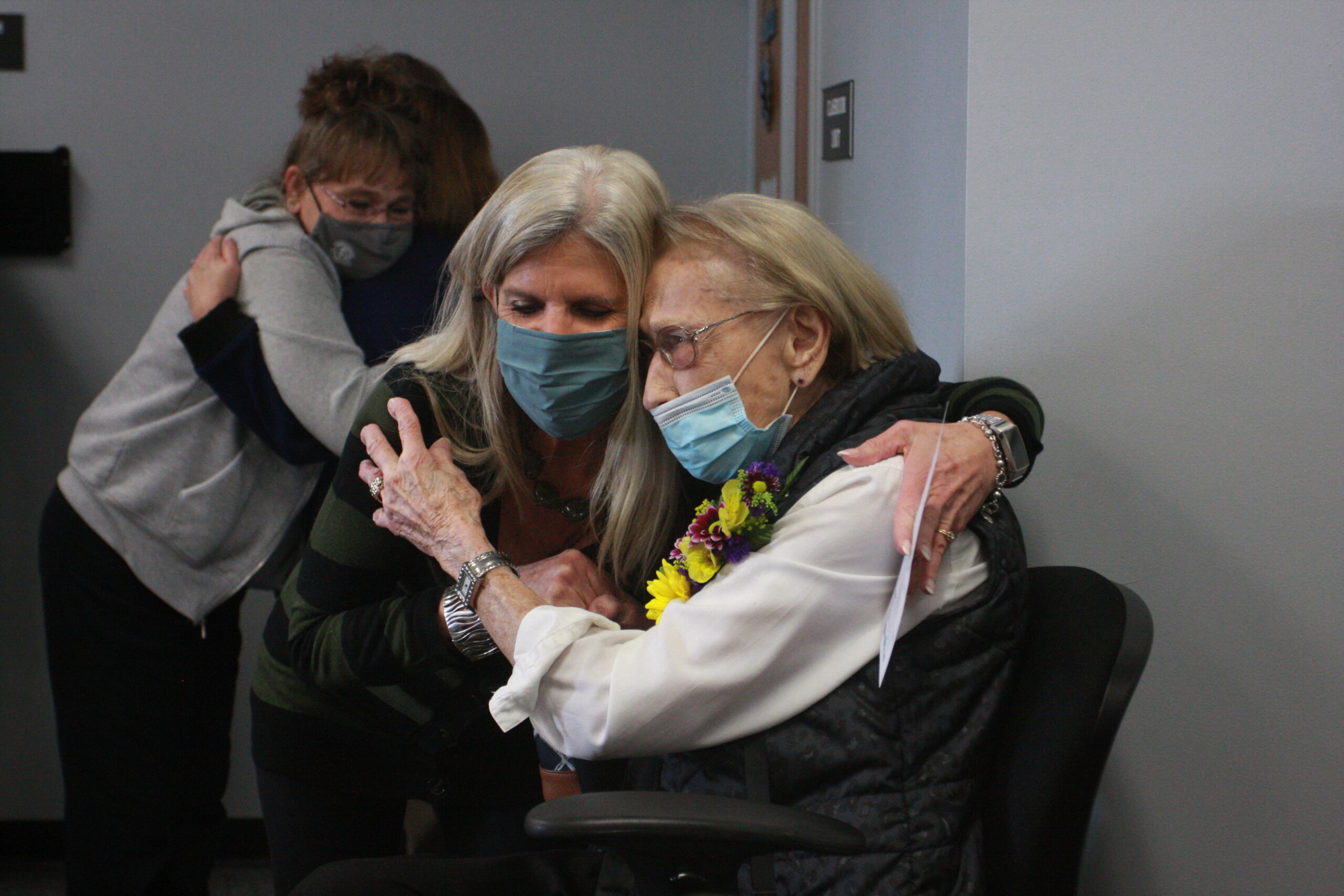 Floris Jean shares an embrace with a staff member from DC3