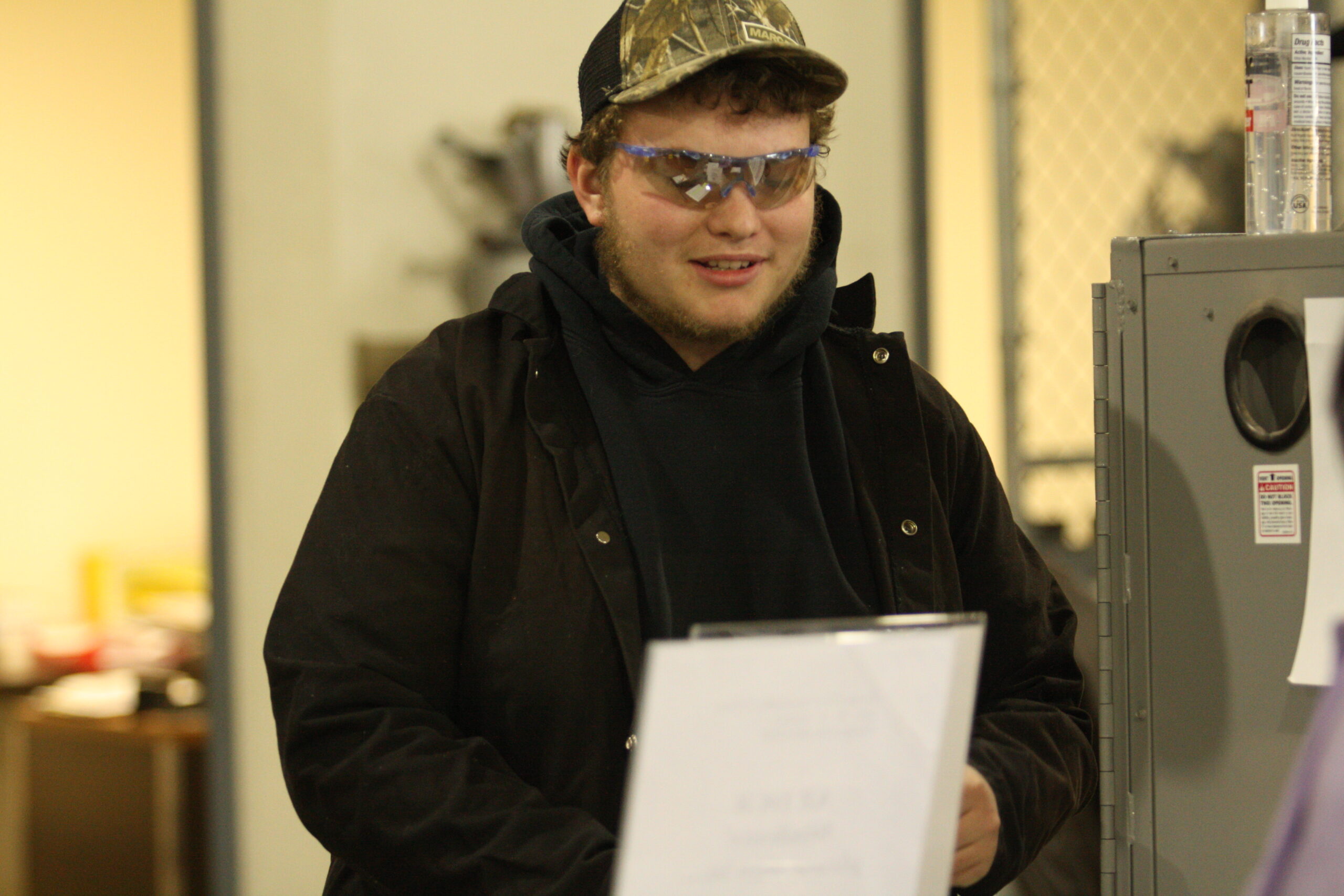 DC3 welding student, Hayden Wallis, readies his résumé for the next recruiter at the Reverse Career Fair on Wednesday, March 24. [Photo by Justin Wilson]