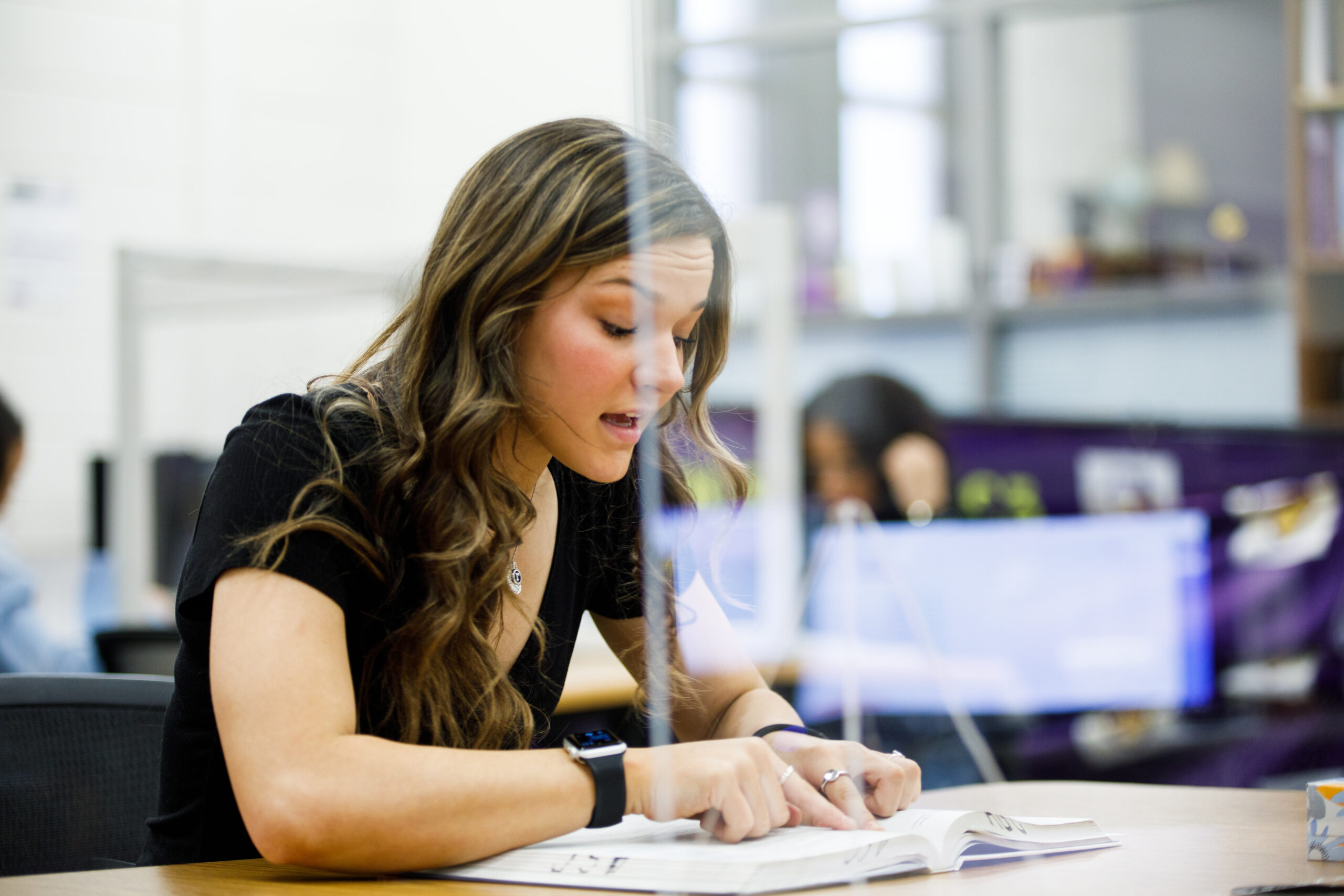 Student reviewing course materials during a study group in the SARC